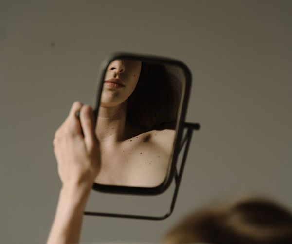 Close-up of a person's chest rising with a deep, calm breath.